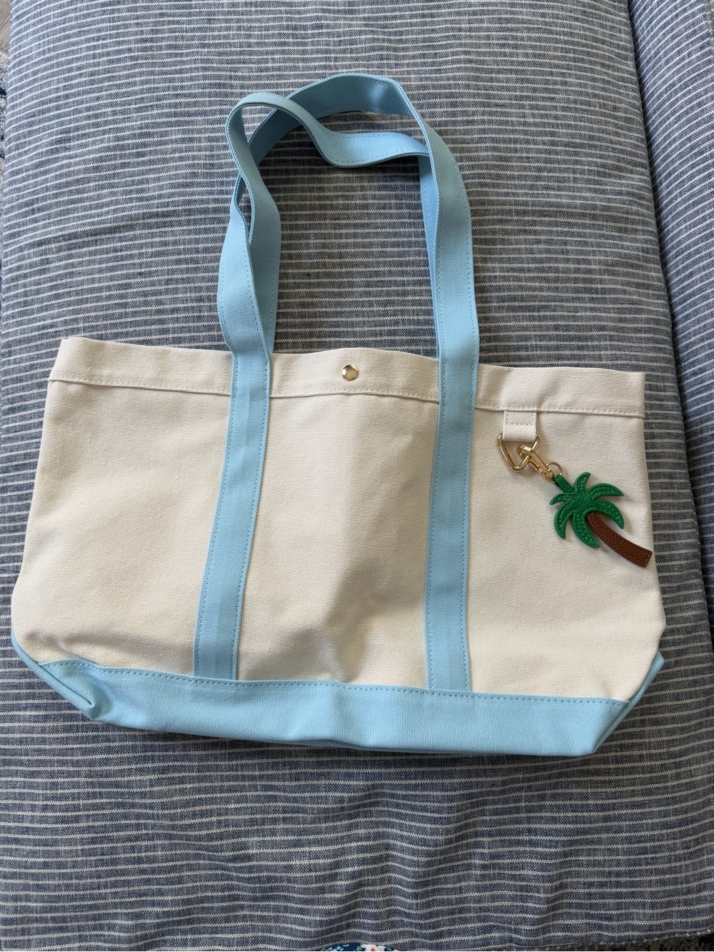 BaubleBar Cream Canvas Tote with Light Blue Trim and Palm Charm